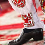 Detail of a male performer's costume.