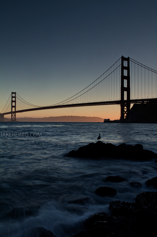 Golden Gate at sunset, from very low on the rock line at Fort Baker