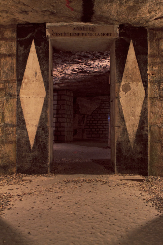 Door in the Paris catacombs before entering the ossuary