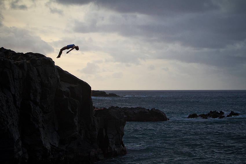 Susanna takes a leap of faith from the jumping rock in Waimea Bay.