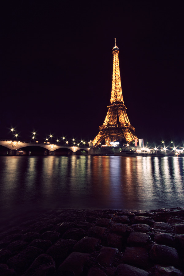 Eiffel Tower at night from across the Seine