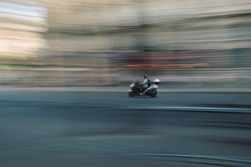 Scooter panning in Paris near Saint-Chapelle